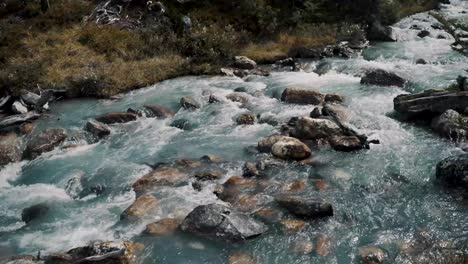 water flowing through the rocky stream in the mountain