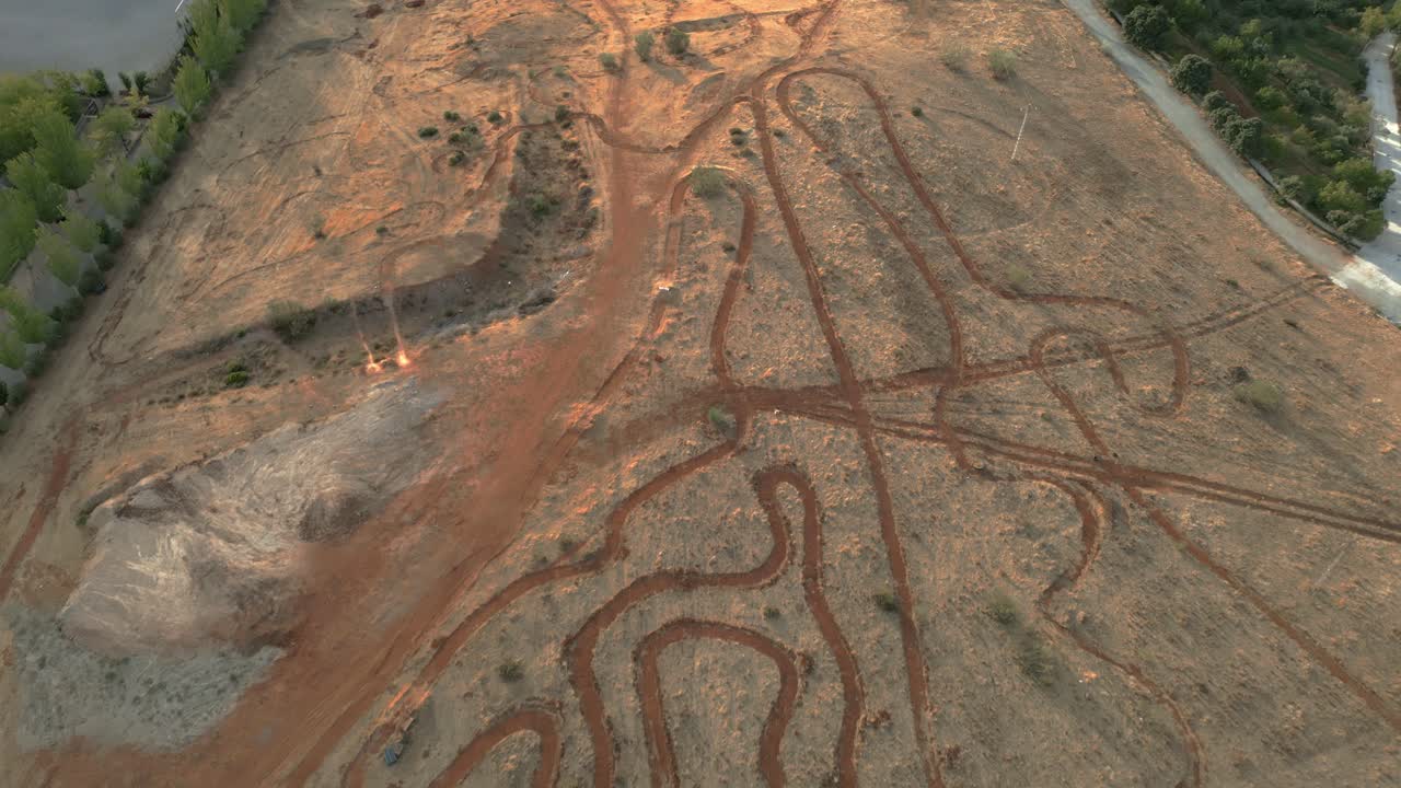 Mountain bike circuit. Panoramic aerial view. Dolly out. Mountain bike racing circuit layout seen from the air. Curves and mountain bike competition circuit route. MTB circuit. Granada. Spain.