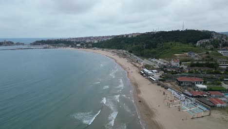 Flying over the junction of sand and sea on the beach