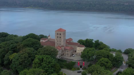 slight raising aerial orbit over the cloisters museum in upper manhattan nyc on the bank of the hudson river