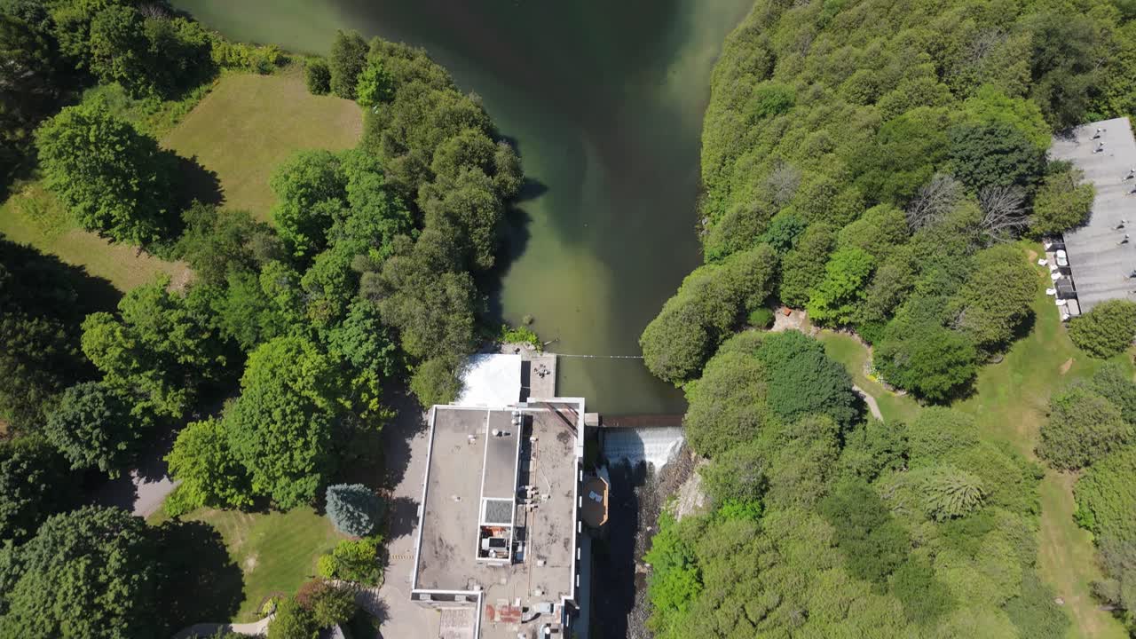 Aerial view of Millcroft Inn amid lush greenery on sunny day in Alton
