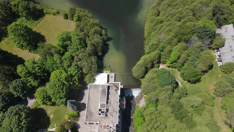 aerial view of millcroft inn amid lush greenery on sunny day in alton