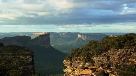handheld shot of the stunning capao valley with large plateaus from the top of mount of pai inácio in the chapada diamantina national park in northern brazil on a warm summer evening
