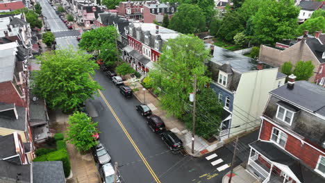 drone shot of rowhouses lining city street