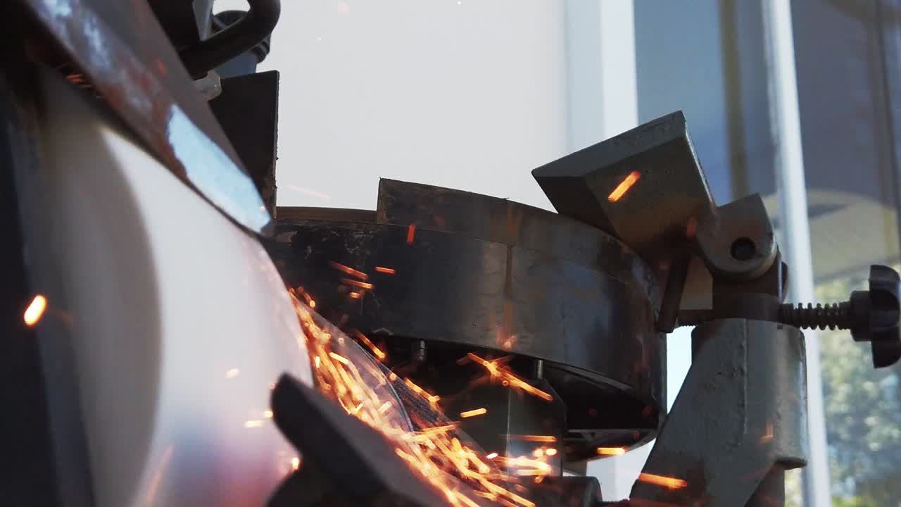 Slow motion video of a knife being sharpened on a knife grinder-1