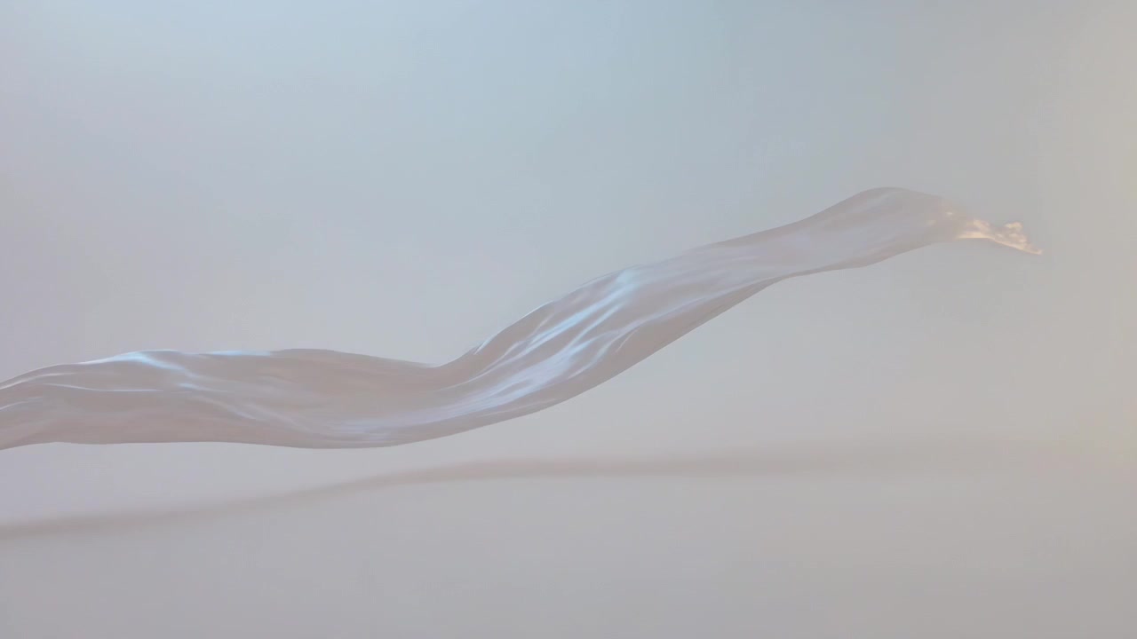 Moving translucent ribbon entering left, shifting right and catching blue-gold highlights in studio