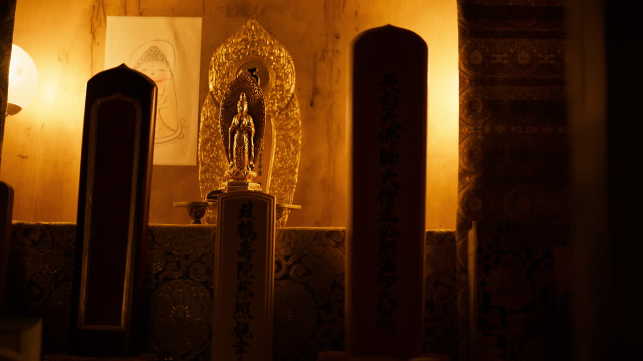 The inside of the of the Otagi Nenbutsuji Temple in Kyoto, Japan with yellow lights. Translation: "A tour of one's true nature at Kakuju-in"