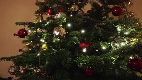 Zooming-out-view-of-a-christmas-decorations-on-pine-tree