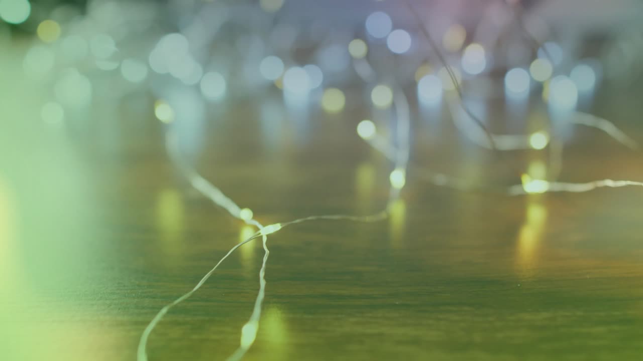 Green wash sweeping left activating LED lights blinking on wooden tabletop illustrating color shift