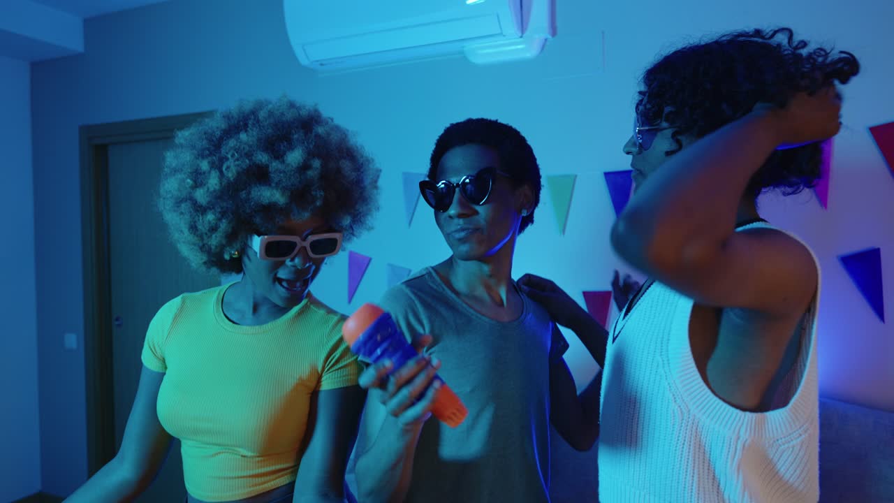 People singing karaoke at a party