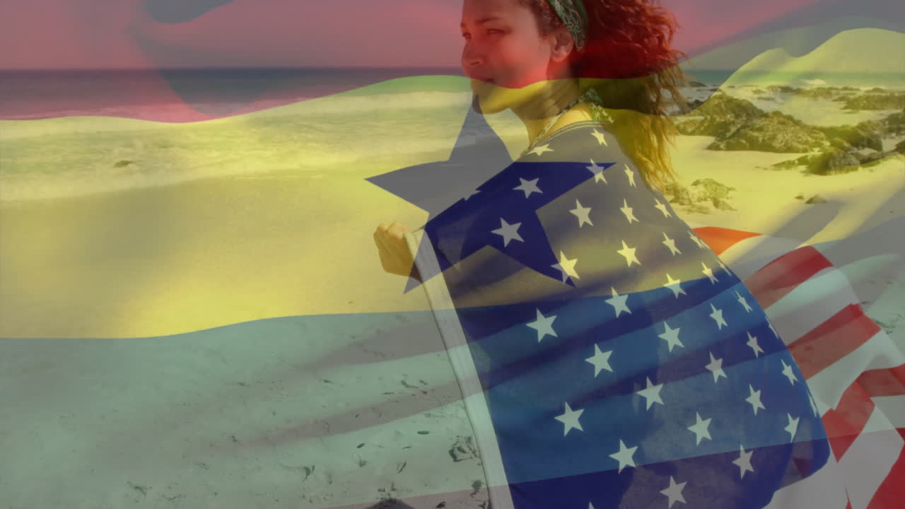 Wrapped in American flag with Ghanaian overlay, woman standing on beach