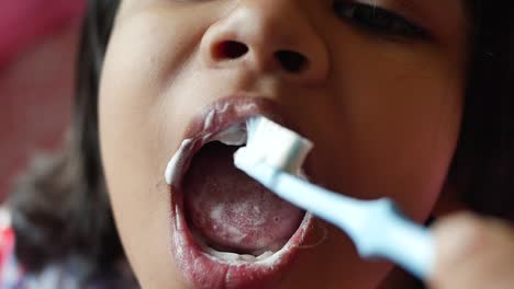 child brushing teeth