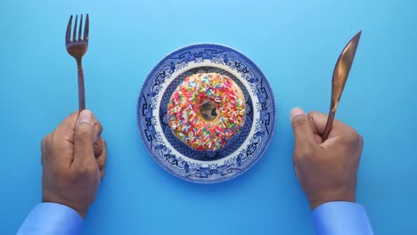 person eating a donut