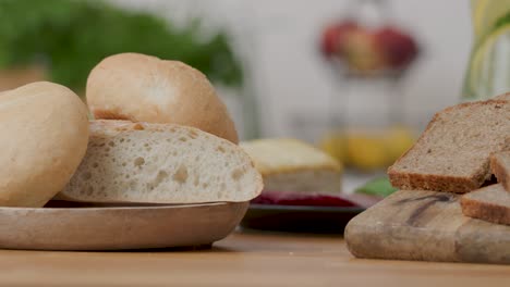 slide right shot 4k of two types of bread, white bread made of wheat flour and wholemeal rye bread