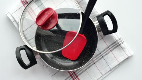 kitchen utensils and pan on a napkin