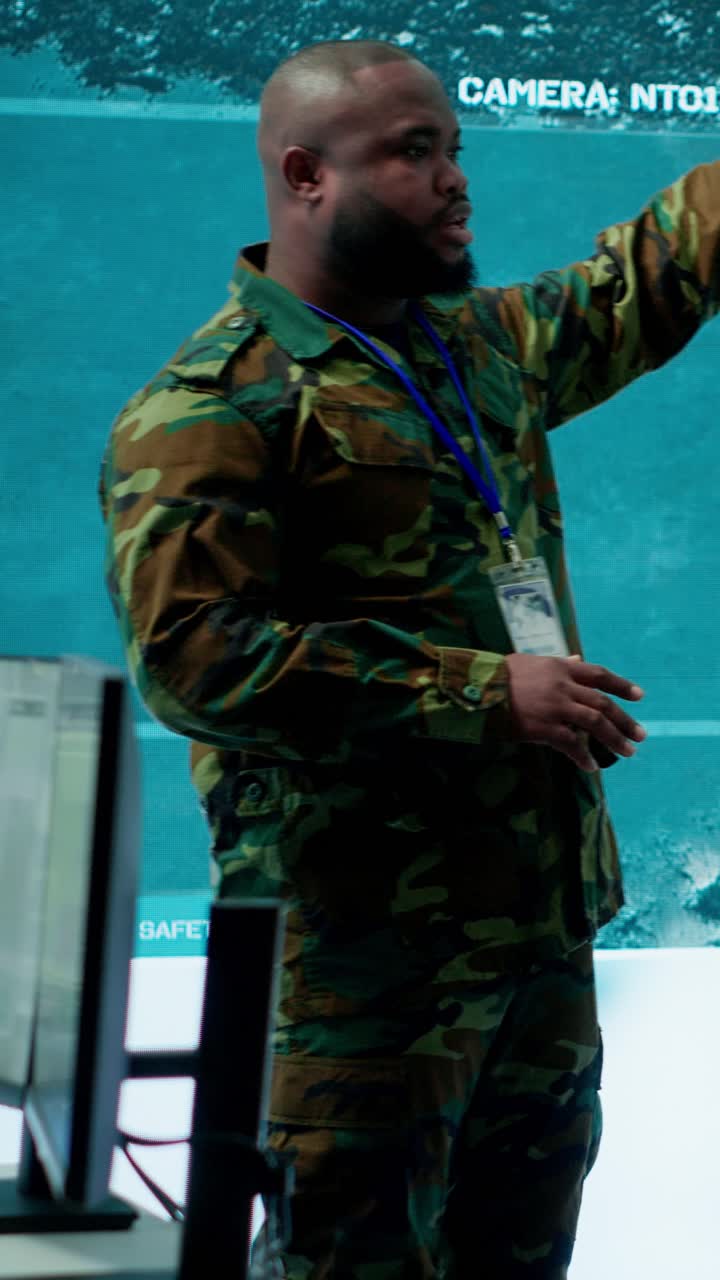 Vertical Video Military personnel operate advanced systems in a command center