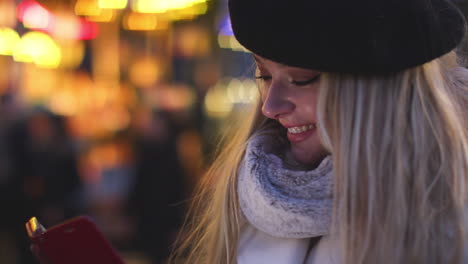 Young-Woman-Wearing-Beret-Checking-Mobile-Phone