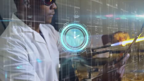 animation of moving clock over african american male scientist working in lab