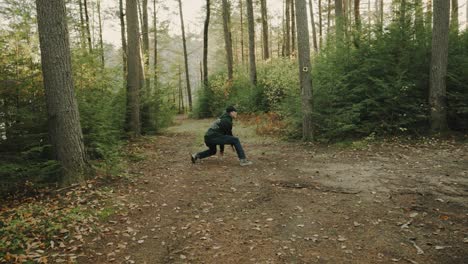 boy acting weird and random in the woods