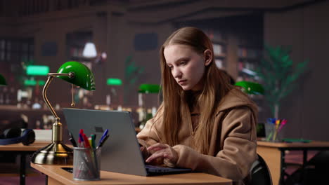 vertical video young adult studying in the university library to obtain her diploma