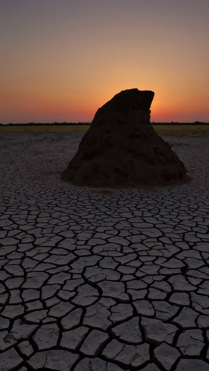Sunset over cracked earth