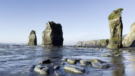 scenic view of the three sisters and the elephant rocks in north coast taranaki, new zealand