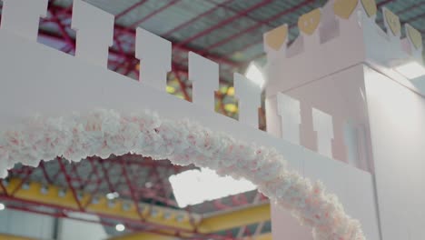 floral decoration adorning a castle-shaped display at an event