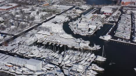 A-high-angle-drone-view-over-Bay-Shore,-NY,-on-a-bright-day-after-a-recent-snowfall