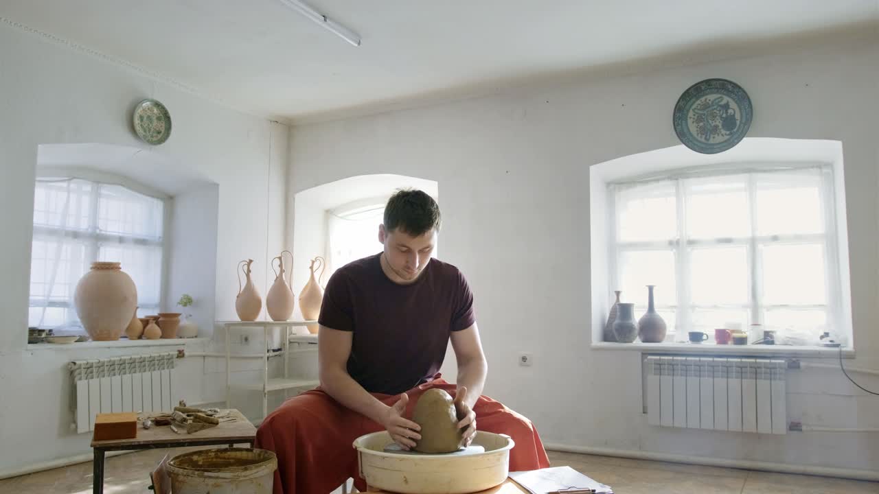 Pottery Artist Working on a Clay Pot on a Pottery Wheel