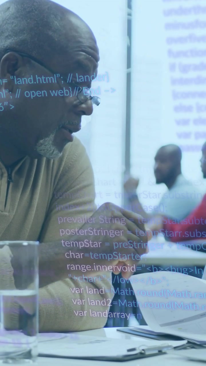 Senior man seeing code, leaning and reviewing notes while overlaying pages and guiding training