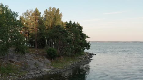 Drone-shot-of-rocky-Baltic-sea-coast-in-Sweden-during-sunset