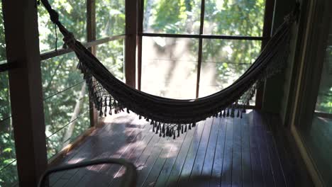 relaxing hammock on a screened porch overlooking lush jungle