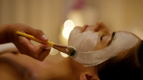 woman receiving a facial mask treatment