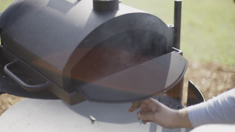 making pizza in a wood-fired oven