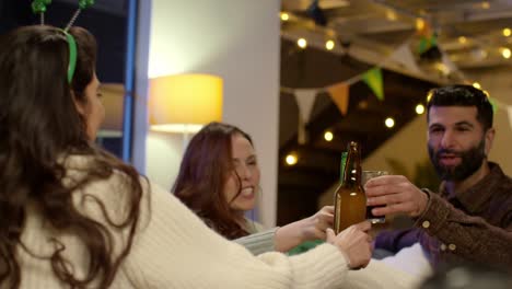 Group-Of-Friends-At-Home-Dressing-Up-Celebrating-At-St-Patrick's-Day-Party-Drinking-Alcohol-And-Doing-Cheers-1