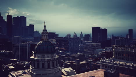 a view of a city skyline with a church dome in the foreground