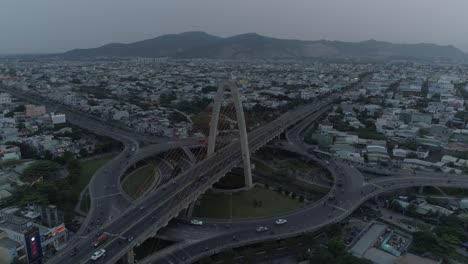 aerial drone footage of multi-level complex overpass transport in asia, loaded with traffic. urbanization and development concept.