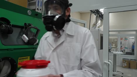 scientist handling hazardous materials in a laboratory setting