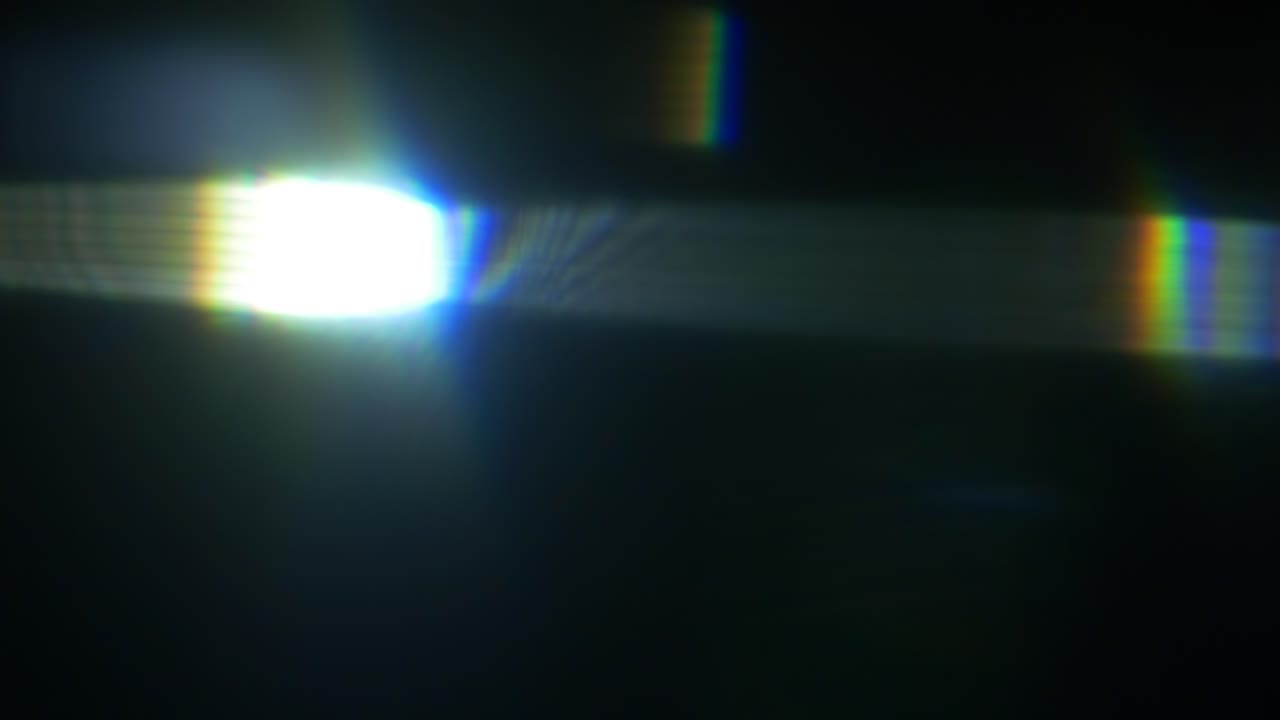 Dynamic Blue Lens Flare Light Leak on Black Background