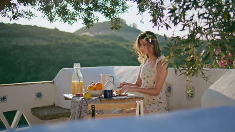 calm lady holding jug preparing food at fresh air. relaxed woman cutting apple