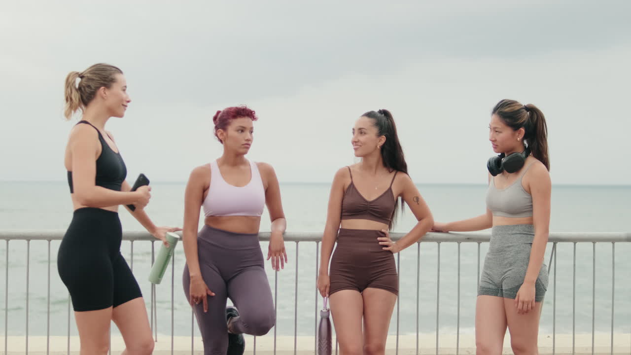Female Friends Chat After Beach Workout