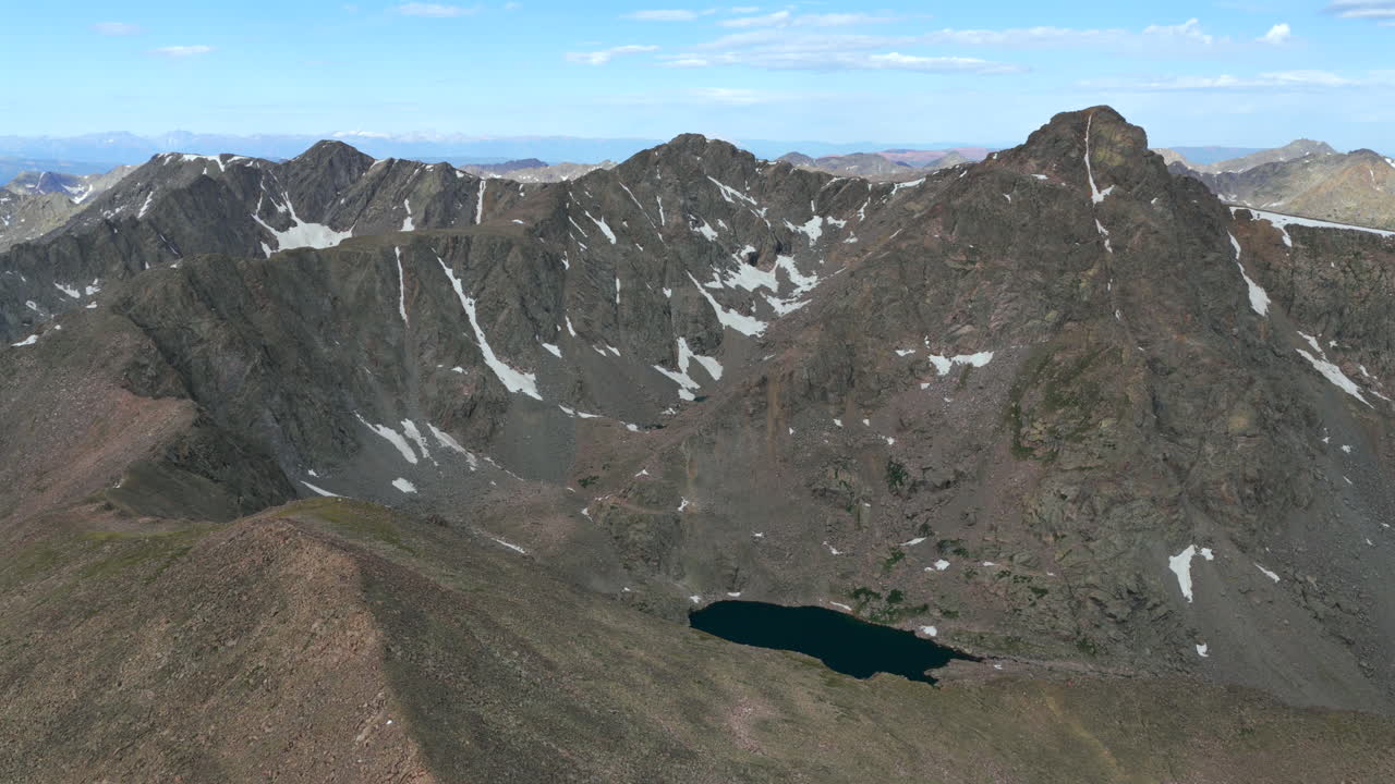 Mount of the Holy Cross 14er prominent peak wilderness landscape view aerial drone Colorado morning clouds North Mountain Shelter Halo Ridge Bowl alpine lake snow melt Rocky Mountains circle left