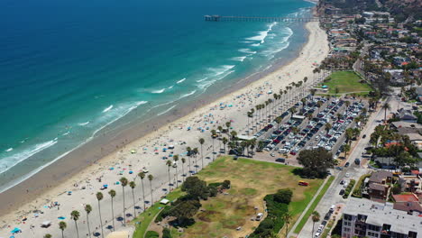 aerial view rotating away from a beach in sunny la jolla, california, usa