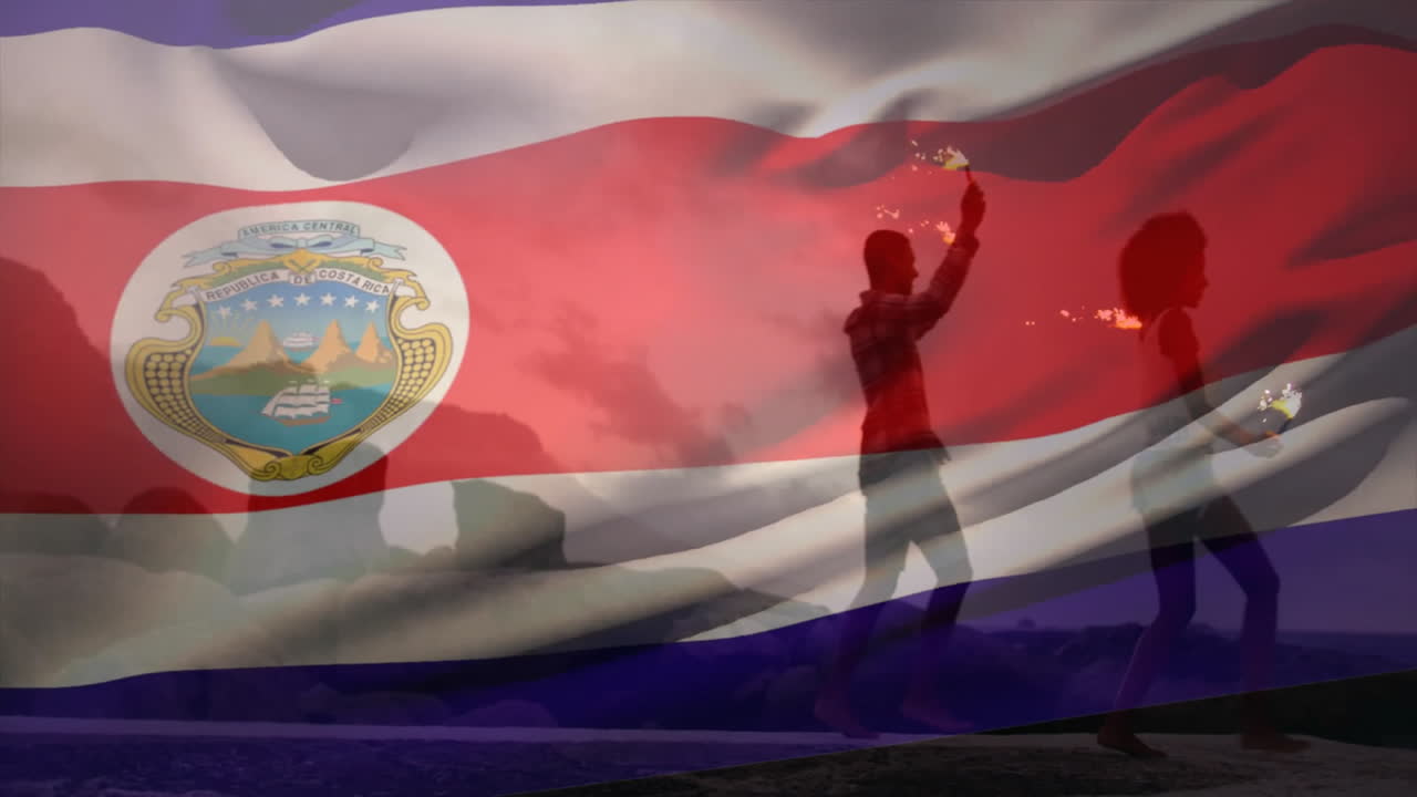 Juggling fire outdoors, silhouette with Costa Rica flag animation overlay