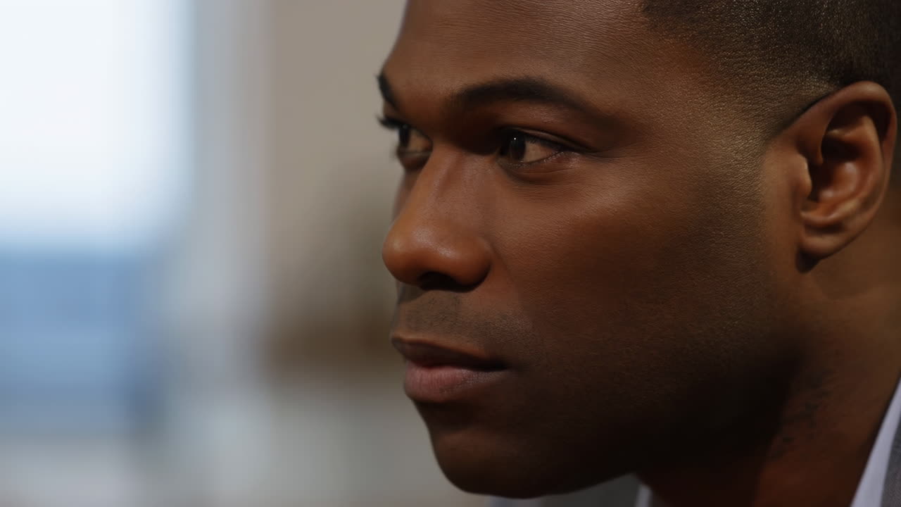 Close-up Profile of Thoughtful Young Black Man