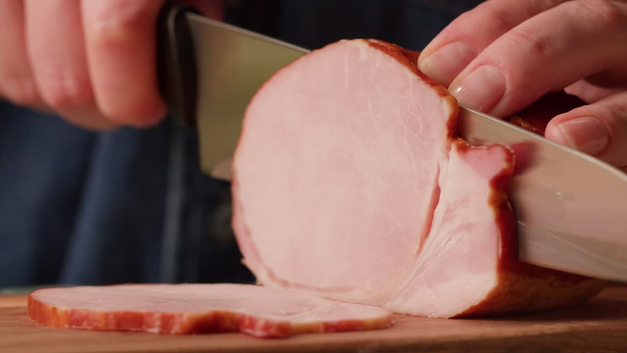 Slicing a piece of ham