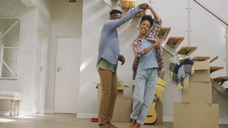 video of happy african american couple embracing after moving into new house