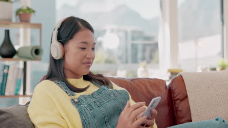 music, headphones and woman with phone on sofa