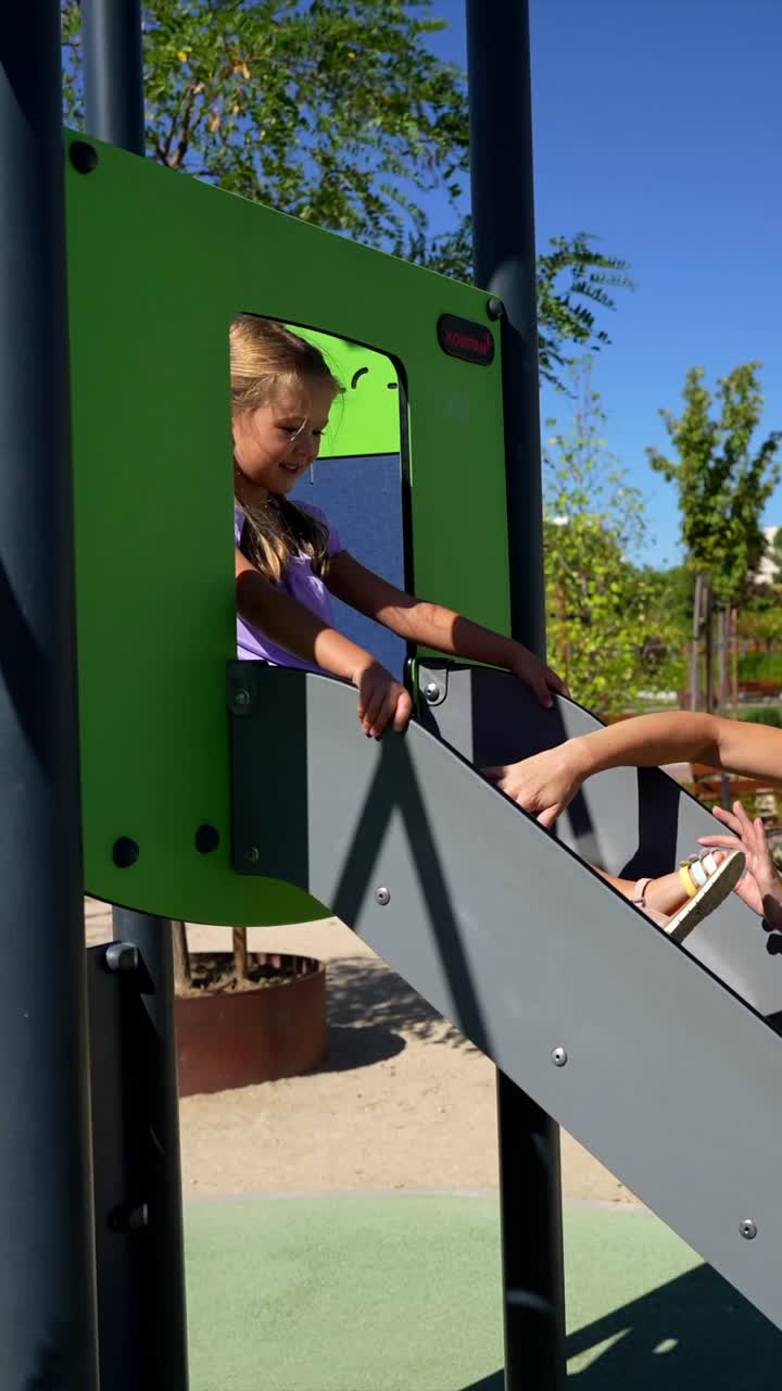 Girl playing on a slide in a park