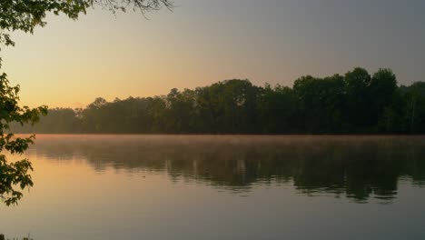 calm morning with fog over water stream by the new river in blacksburg virginia